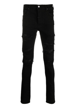 AMIRI logo-patch cotton-blend skinny jeans - Black