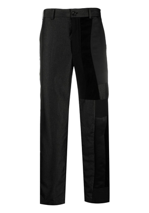 Black Comme Des Garçons patchwork straight-leg trousers