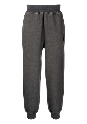 izzue garment-dyed tapered track pants - Grey
