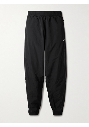 Nike - Solo Swoosh Tapered Logo-Embroidered Taffeta Track Pants - Men - Black - S