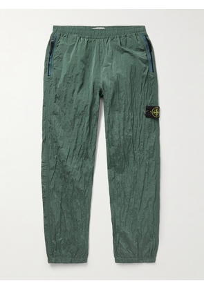 Stone Island - Tapered Logo-Appliquéd ECONYL® Nylon Metal Trousers - Men - Green - UK/US 28