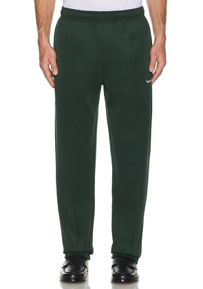 Museum of Peace and Quiet Warm Up Track Pant in Green. Size M, S, XL/1X, XS.