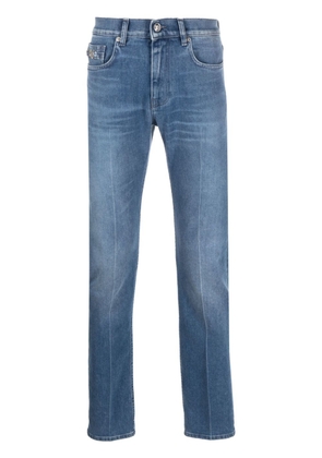 Versace logo-patch slim-cut jeans - Blue