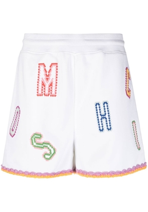 Moschino logo-embroidered lace-trim shorts - White