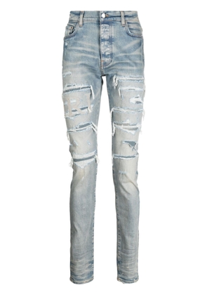 AMIRI Varsity ripped skinny jeans - Blue