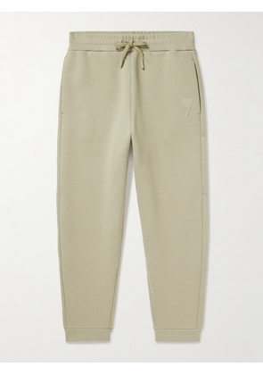 AMI PARIS - Tapered Logo-Embossed Cotton-Blend Sweatpants - Men - Green - XS