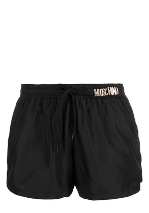 Moschino logo-plaque swim shorts - Black