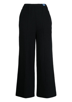 Maison Mihara Yasuhiro exposed-seam knitted trousers - Black