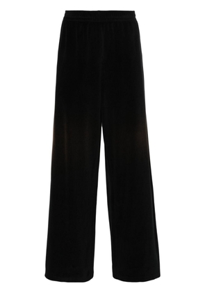 Acne Studios logo-embossed velvet trousers - Black