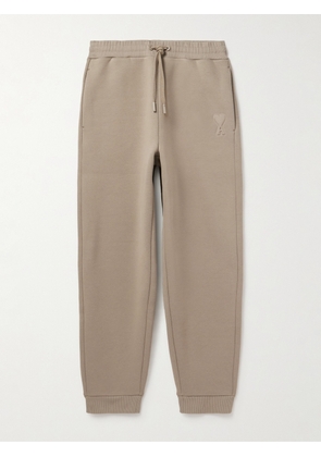 AMI PARIS - Tapered Logo-Embossed Cotton-Blend Sweatpants - Men - Neutrals - XS