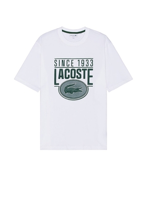Lacoste Large Croc Loose Fit Tee in White. Size 4, 5, 6.