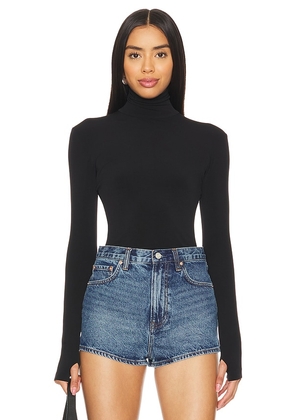 Norma Kamali Slim Fit Long Sleeve Turtleneck Top in Black. Size M, S, XL, XS, XXS.