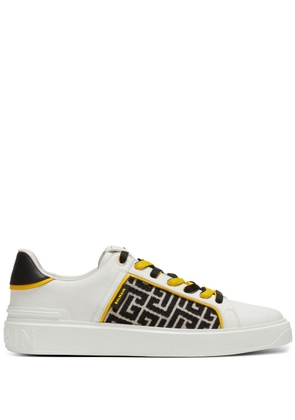 Balmain monogram-pattern lace-up sneakers - White