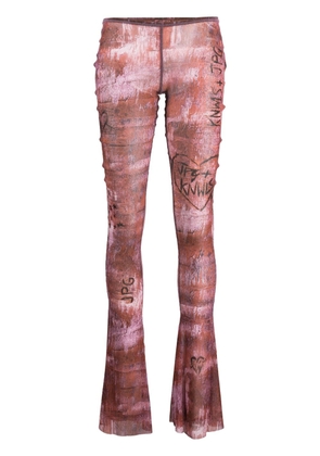 Jean Paul Gaultier x KNWLS graphic-print flared trousers - Brown