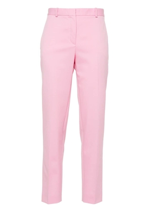 Versace pressed-crease tapered-leg trousers - Pink