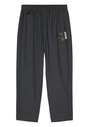 Undercover logo-appliqué straight trousers - Grey