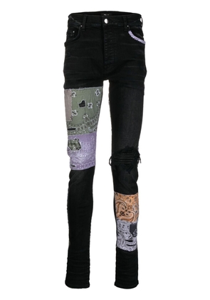 AMIRI distressed patchwork skinny jeans - Black