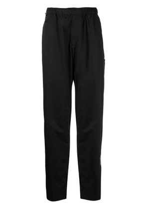 Undercover logo-patch elasticated-waistband trousers - Black