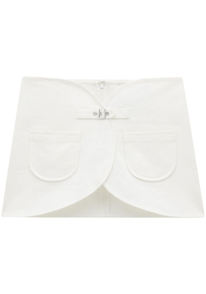 Courrèges Ellipse buckle-strap denim miniskirt - White