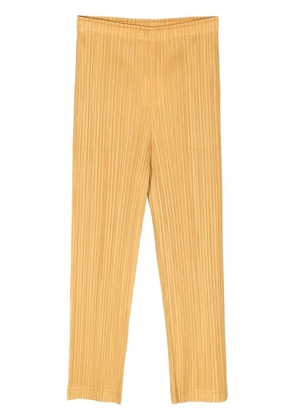 Pleats Please Issey Miyake plissé cropped trousers - Yellow