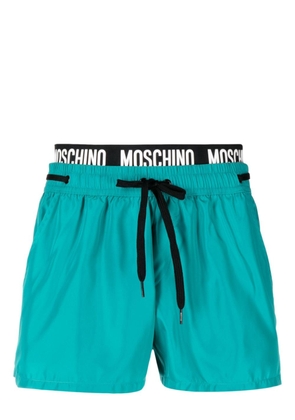 Moschino logo-waistband beach shorts - Green