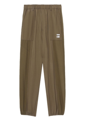 izzue logo-appliqué tapered track pants - Green
