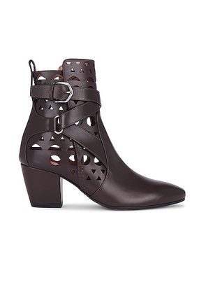ALAÏA Perforated Ankle Boot in Marron Fonce - Brown. Size 36 (also in 36.5, 37, 37.5, 38, 38.5, 39).