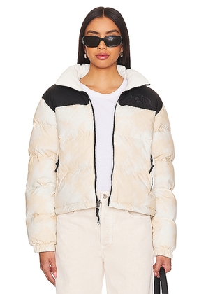 The North Face Crinkle Rev Nuptse Jacket in Cream. Size M, S, XL/1X, XS.