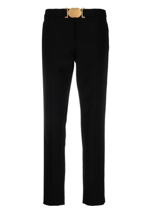 Moschino Smiley-buckle tapered trousers - Black
