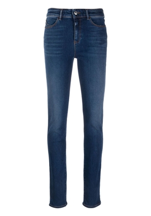 Emporio Armani embroidered-logo skinny-cut mid-rise jeans - Blue