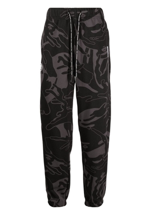 AAPE BY *A BATHING APE® graphic-print tapered trousers - Black