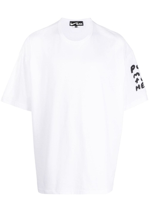 Black Comme Des Garçons slogan-print T-shirt - White