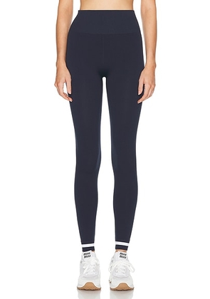 THE UPSIDE Form Seamless 25 in Midi Pant in Navy - Navy. Size L (also in M, S, XS).