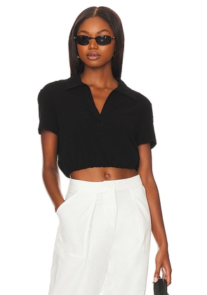 The Range Sueded Jersey Bubble Cropped Polo in Black. Size XS.