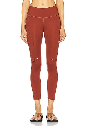 On Performance 7/8 Tight in Ruby - Rust. Size S (also in XS).