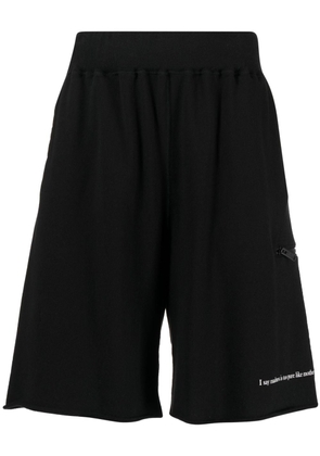 Undercover slogan-print cotton track shorts - Black
