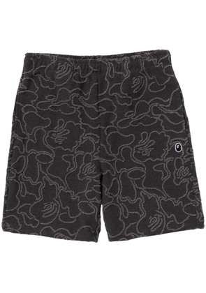 A BATHING APE® camouflage-print cotton track shorts - Black