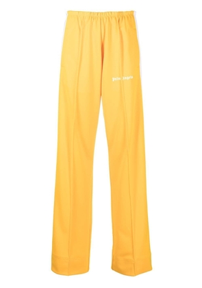 Palm Angels logo-print loose-fit track pants - Yellow
