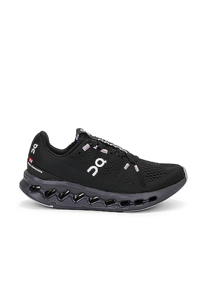 On Cloudsurfer Sneaker in All Black - Black. Size 5 (also in 5.5, 6.5, 7, 8, 8.5, 9, 9.5).