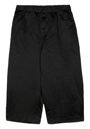 Black Comme Des Garçons elasticated-waist wide-leg shorts