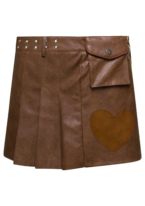 Andersson Bell Arina Brown Pleated Mini Skirt With Heart And Patch Pocket Detail In Faux Leather Woman