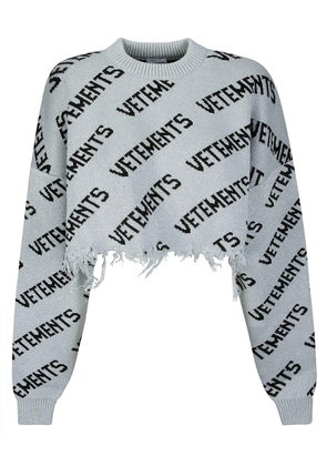 Vetements All-Over Logo Printed Cropped Sweater
