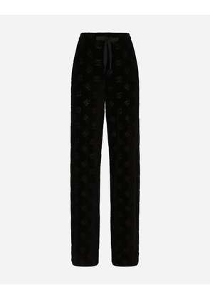 Dolce & Gabbana Flocked Jersey Pants With All-over Dg Logo - Woman Trousers And Shorts Black Cotton 50