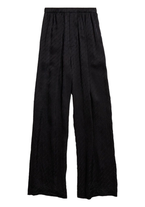 Balenciaga Stencil logo-print satin trousers - Black