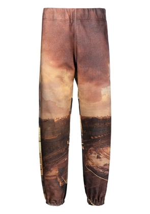 Undercover all-over city print track pants - Brown