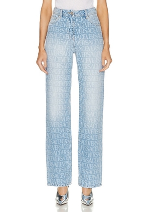 VERSACE All Over Logo Skinny in Light Blue - Blue. Size 27 (also in ).