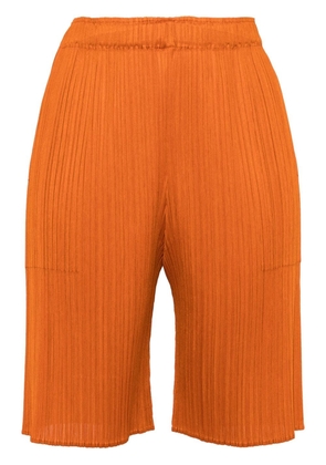 Pleats Please Issey Miyake knee-length pleated shorts - Orange