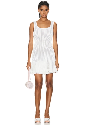 ALAÏA Pleated Mini Dress in Blanc & Ivoire - White. Size 36 (also in ).