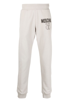 Moschino logo print tapered sweatpants - Grey