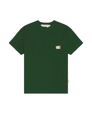 Advisory Board Crystals Pocket T-shirt in Dark Green. Size S, XL/1X.
